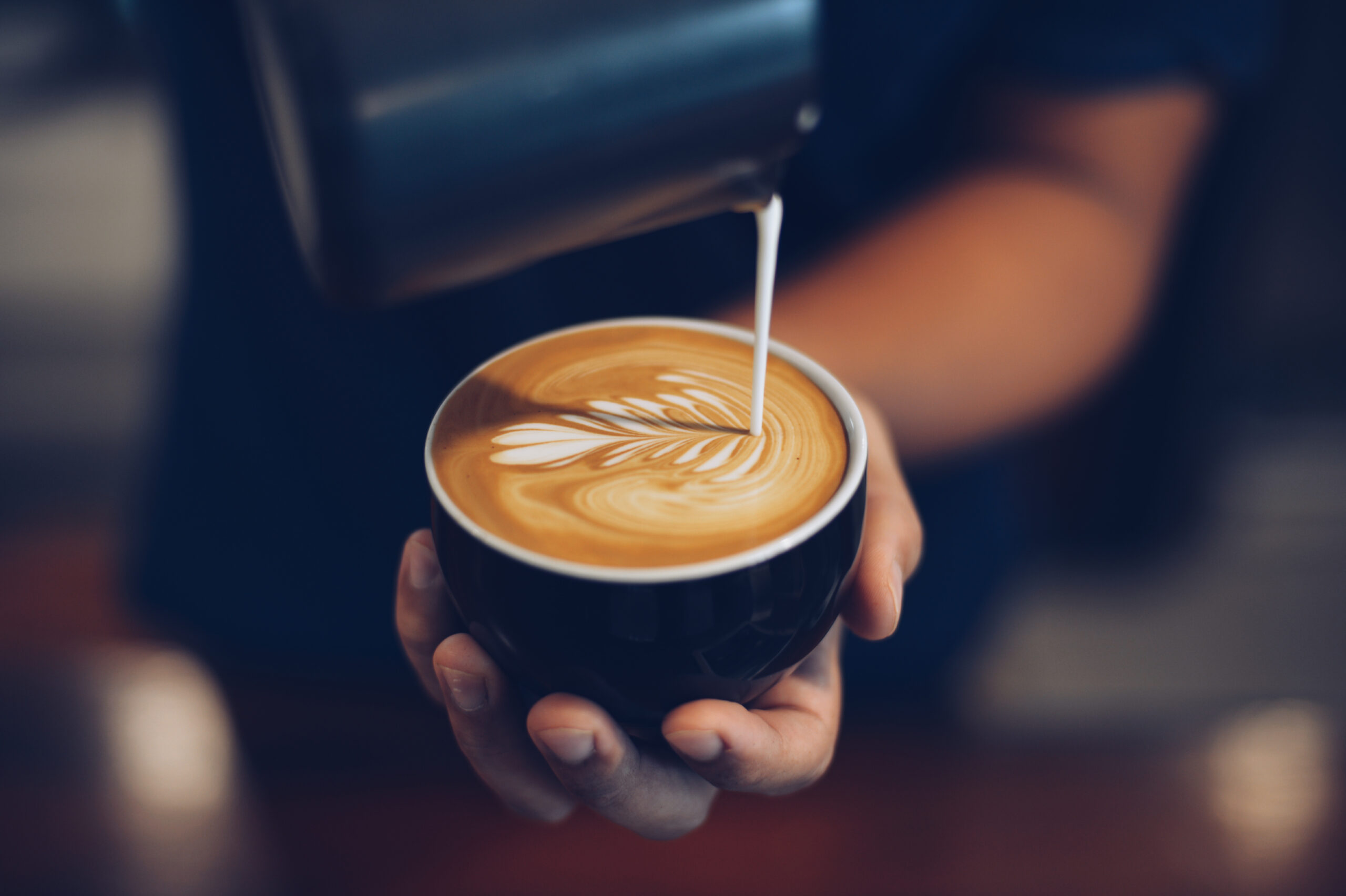 Latte in a cup with frothy milk